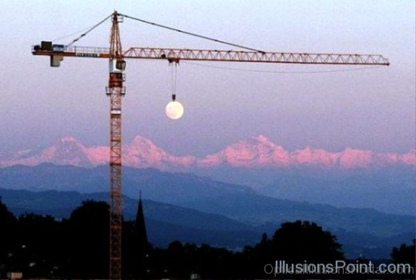 Crane Raising The Moon Illusion